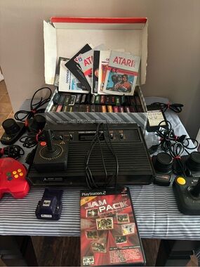 ATARI 2600 Classic Video Game Console With 43 video Games and Extra Pieces Lot.